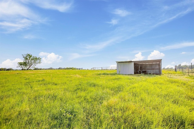 1501 County Road 909, Joshua, TX 76058 - view of yard featuring an outbuilding and a rural view