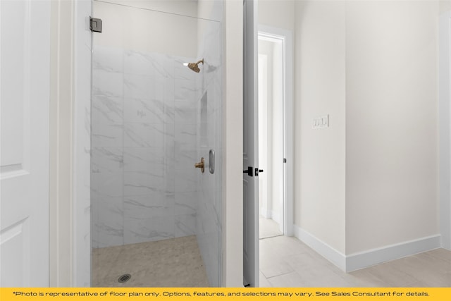802 Marathon Ct, Rockwall, TX 75087 - bathroom with a marble finish shower, baseboards, and tile patterned floors