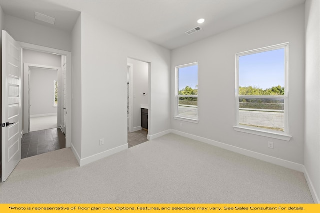 802 Marathon Ct, Rockwall, TX 75087 - unfurnished bedroom with carpet, baseboards, ensuite bathroom, and recessed lighting