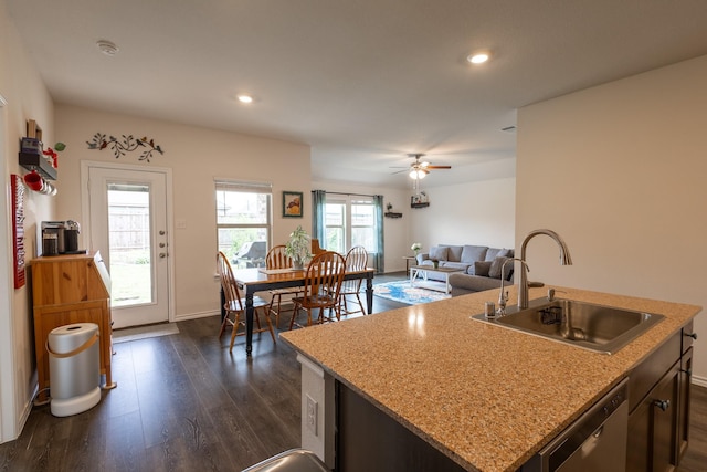 1003 Dewy Glen Ln, Princeton, TX 75407 - kitchen with a sink, stainless steel dishwasher, dark wood-style flooring, recessed lighting, and a center island with sink