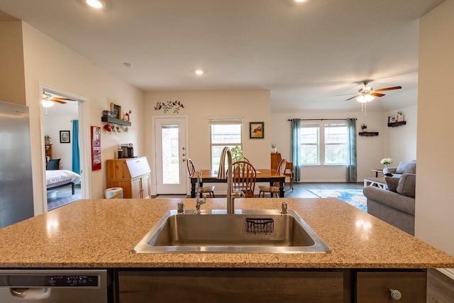 1003 Dewy Glen Ln, Princeton, TX 75407 - kitchen with a sink, dishwasher, ceiling fan, open floor plan, and recessed lighting