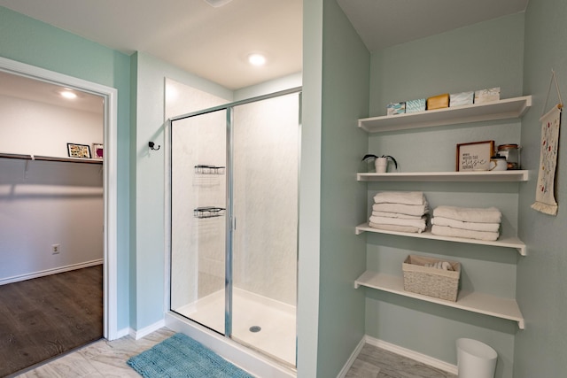 1003 Dewy Glen Ln, Princeton, TX 75407 - bathroom with a stall shower, a spacious closet, and baseboards