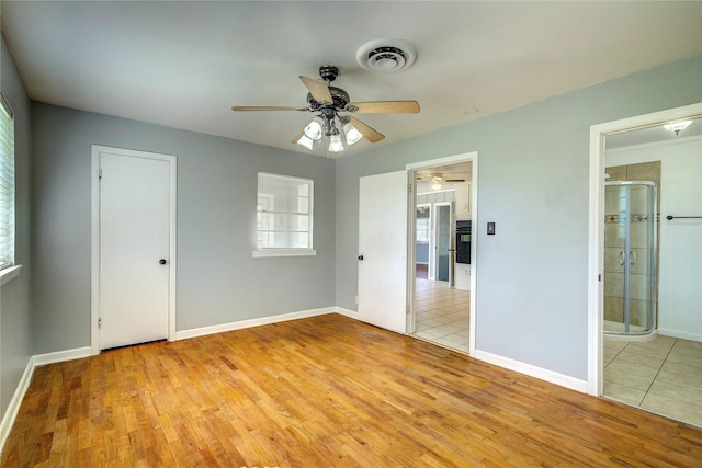 508 Ward St, Winnsboro, TX 75494 - unfurnished bedroom featuring light wood-style floors, baseboards, and ceiling fan