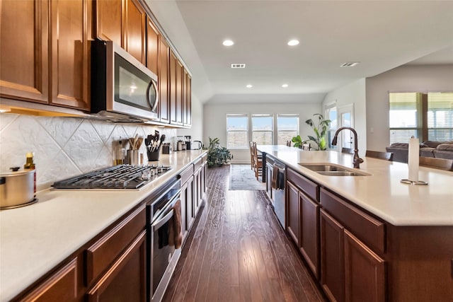 1424 Millican Ln, Aubrey, TX 76227 - kitchen featuring stainless steel appliances, a sink, recessed lighting, dark wood-style flooring, and light countertops