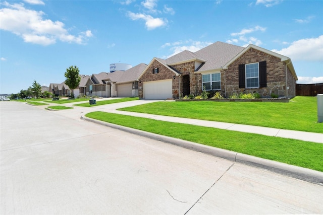 1424 Millican Ln, Aubrey, TX 76227 - view of front of house with a garage, concrete driveway, stone siding, a front yard, and a residential view