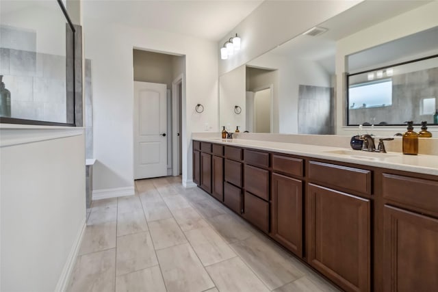 1424 Millican Ln, Aubrey, TX 76227 - full bathroom with double vanity and baseboards