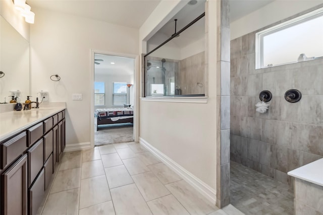 1424 Millican Ln, Aubrey, TX 76227 - ensuite bathroom featuring a walk in shower, healthy amount of natural light, vanity, and tile patterned flooring