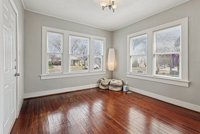 4617 El Campo Ave, Fort Worth, TX 76107 - unfurnished room with a chandelier, wood-type flooring, ornamental molding, and baseboards