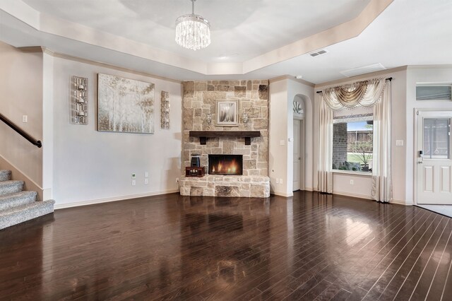 3113 Sangria Ln, Fort Worth, TX 76177 - unfurnished living room featuring a chandelier, a raised ceiling, wood finished floors, and stairs
