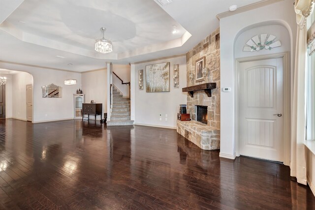 3113 Sangria Ln, Fort Worth, TX 76177 - living area with a chandelier, a fireplace, a tray ceiling, and hardwood / wood-style floors