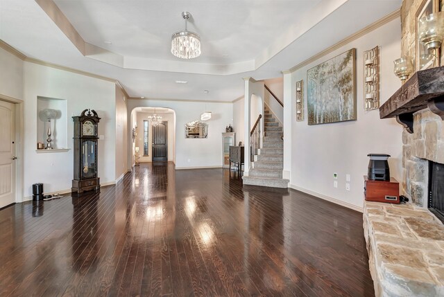 3113 Sangria Ln, Fort Worth, TX 76177 - foyer entrance with a chandelier, arched walkways, hardwood / wood-style flooring, a raised ceiling, and crown molding