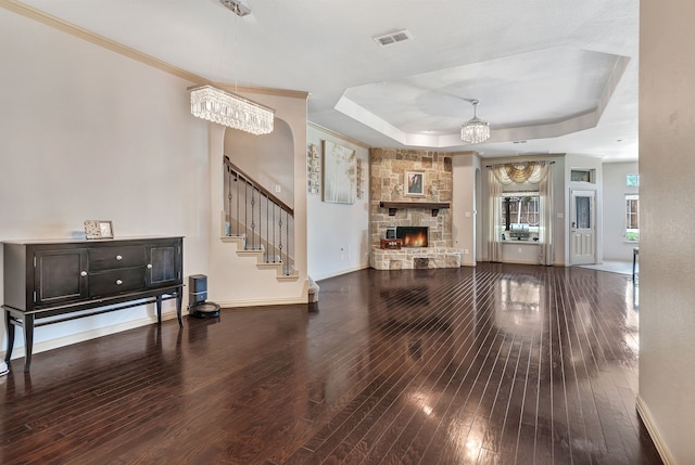 3113 Sangria Ln, Fort Worth, TX 76177 - living area featuring wood-type flooring, a tray ceiling, stairway, a fireplace, and ornamental molding