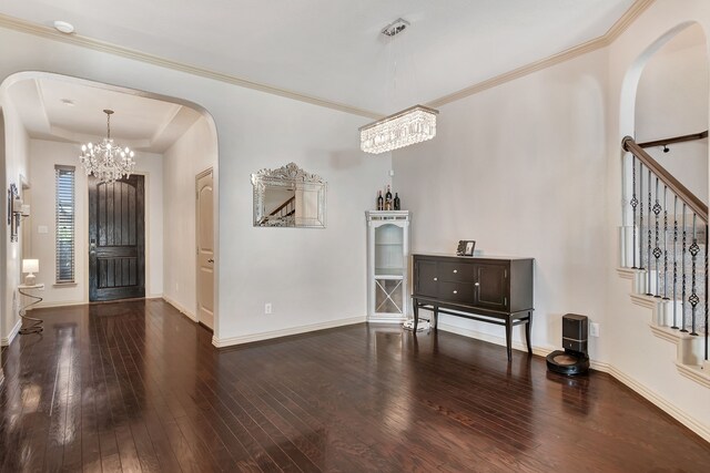 3113 Sangria Ln, Fort Worth, TX 76177 - foyer entrance with a chandelier, wood-type flooring, arched walkways, and a raised ceiling