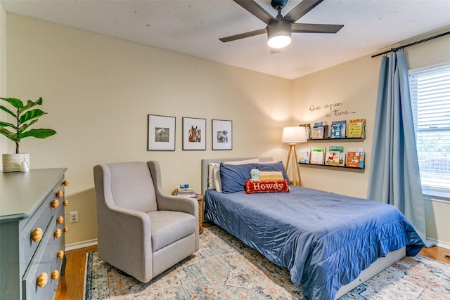 4223 Wild Plum Dr, Carrollton, TX 75010 - bedroom with wood finished floors, baseboards, and multiple windows