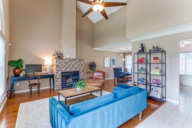 4223 Wild Plum Dr, Carrollton, TX 75010 - living area featuring high vaulted ceiling, ceiling fan, baseboards, a fireplace, and a desk