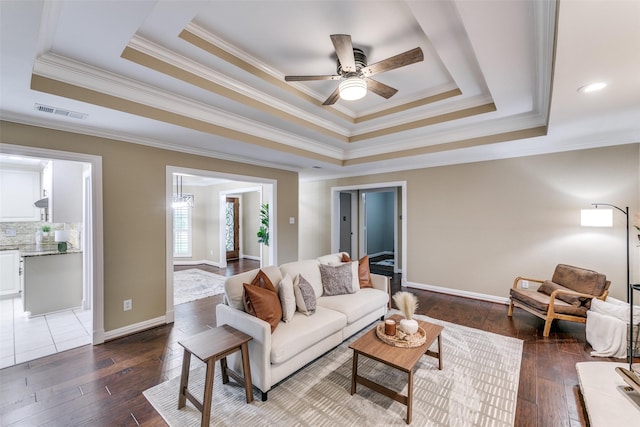 13914 Overlook Ln, Forney, TX 75126 - living room with a raised ceiling, dark wood-style flooring, crown molding, and ceiling fan