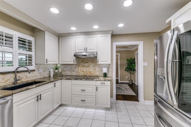 13914 Overlook Ln, Forney, TX 75126 - kitchen featuring appliances with stainless steel finishes, a sink, backsplash, under cabinet range hood, and white cabinetry