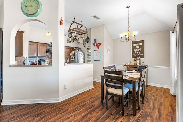 5608 Aberdeen Ct, Temple, TX 76502 - dining room with a chandelier, dark wood finished floors, vaulted ceiling, and baseboards
