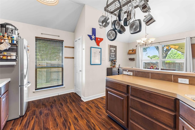 5608 Aberdeen Ct, Temple, TX 76502 - kitchen with freestanding refrigerator, a chandelier, dark wood-type flooring, baseboards, and light countertops