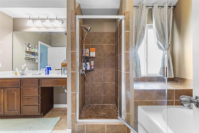 5608 Aberdeen Ct, Temple, TX 76502 - bathroom with a garden tub, tile patterned flooring, a stall shower, and vanity