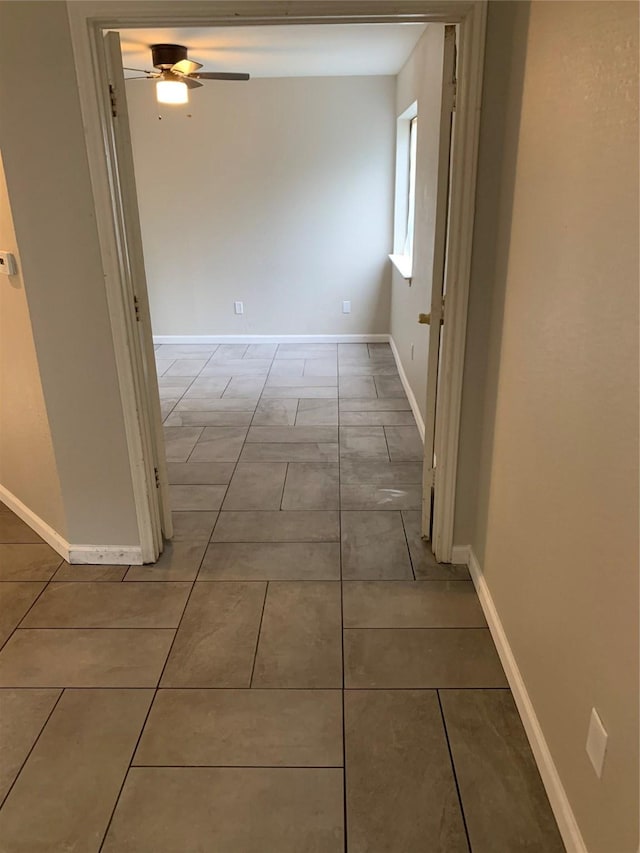 9823 Walnut St Unit L112, Dallas, TX 75243 - hall featuring baseboards and tile patterned floors