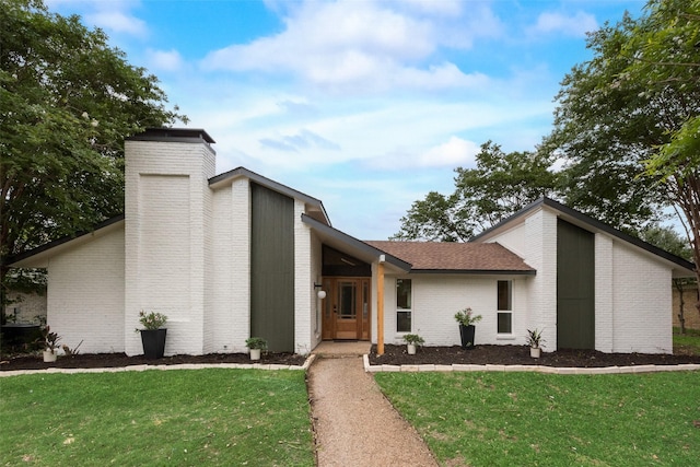 3605 Jomar Dr, Plano, TX 75075 - mid-century inspired home with a chimney, brick siding, and a front lawn