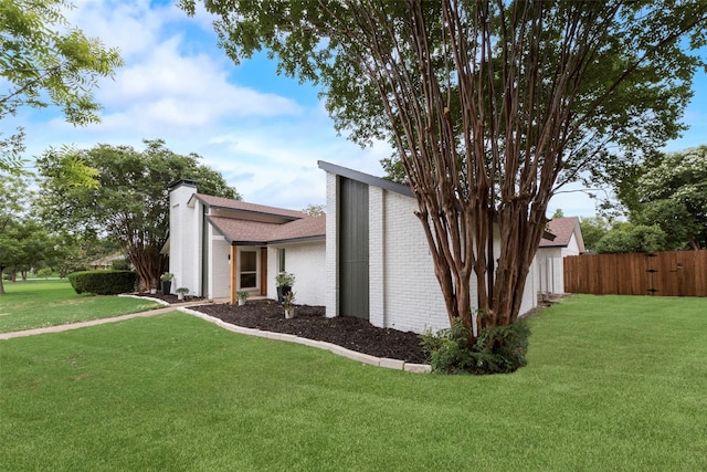 3605 Jomar Dr, Plano, TX 75075 - view of property exterior with brick siding, a chimney, and a shingled roof