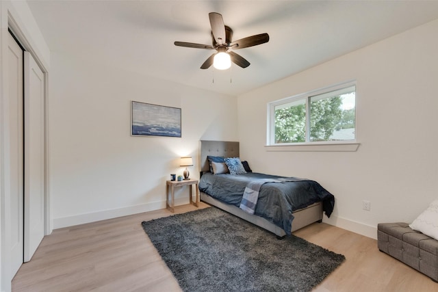 3605 Jomar Dr, Plano, TX 75075 - bedroom with light wood finished floors, baseboards, and a ceiling fan