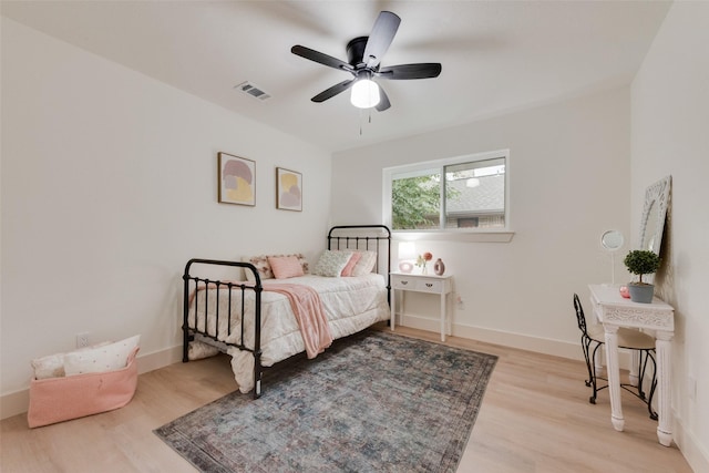 3605 Jomar Dr, Plano, TX 75075 - bedroom with light wood-style floors, baseboards, and ceiling fan