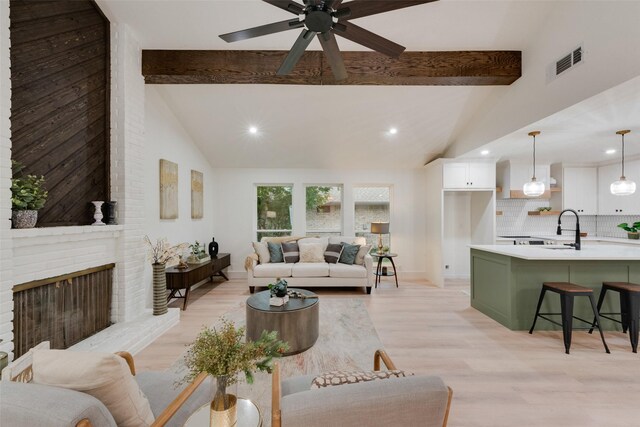 3605 Jomar Dr, Plano, TX 75075 - living area with a ceiling fan, recessed lighting, a brick fireplace, and light wood-type flooring