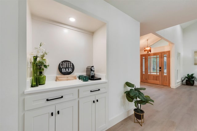 3605 Jomar Dr, Plano, TX 75075 - bar featuring a chandelier, light wood finished floors, baseboards, vaulted ceiling, and recessed lighting
