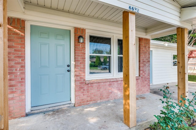6632 Avalon Dr, Watauga, TX 76148 - view of exterior entry featuring brick siding and covered porch