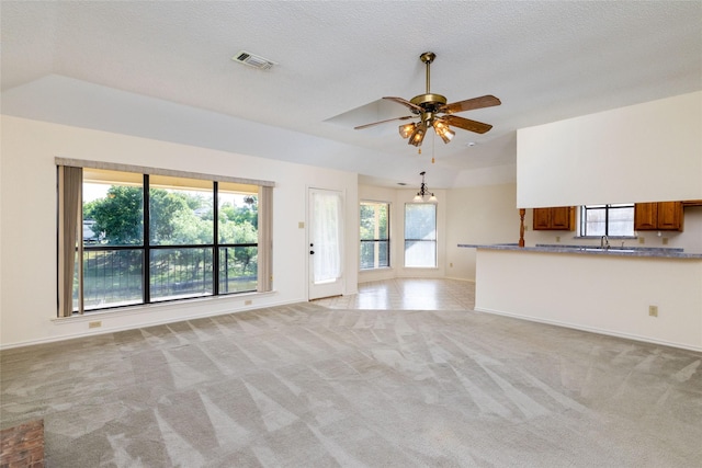 4007 Cherokee Ct, Granbury, TX 76048 - unfurnished living room featuring light colored carpet, a ceiling fan, baseboards, and a sink