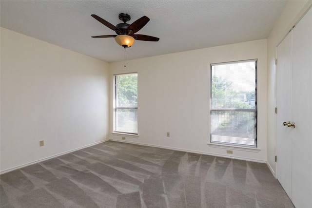 4007 Cherokee Ct, Granbury, TX 76048 - carpeted empty room featuring ceiling fan, baseboards, and a textured ceiling