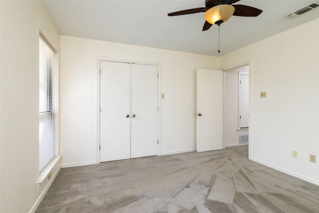 4007 Cherokee Ct, Granbury, TX 76048 - unfurnished bedroom featuring carpet, a closet, ceiling fan, and baseboards