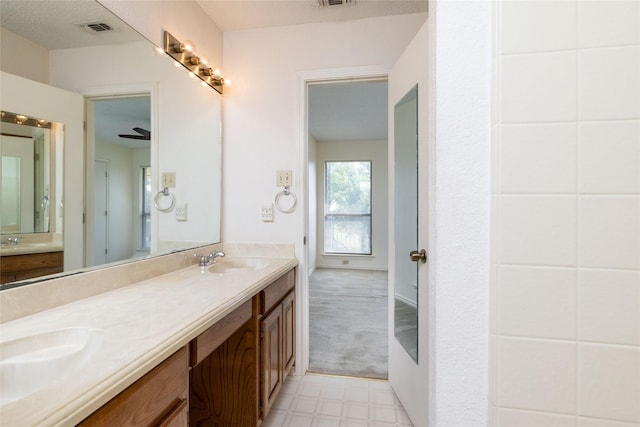 4007 Cherokee Ct, Granbury, TX 76048 - bathroom featuring double vanity and tile patterned floors