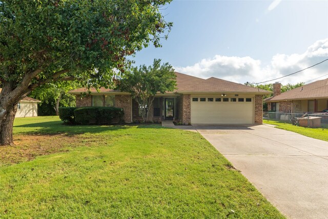4007 Cherokee Ct, Granbury, TX 76048 - ranch-style house featuring a garage, concrete driveway, and brick siding