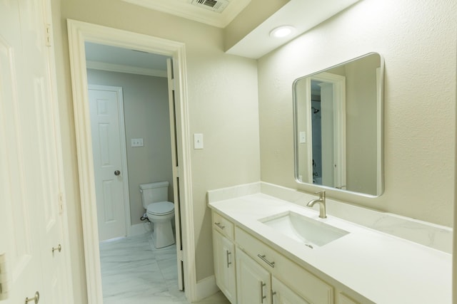 2302 Tiffany Ct, Garland, TX 75043 - bathroom with marble look tiles, vanity, toilet, and crown molding