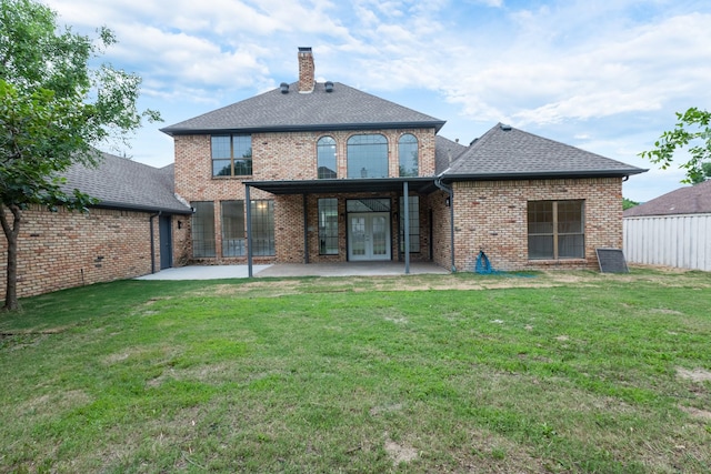 2302 Tiffany Ct, Garland, TX 75043 - back of house featuring french doors, a patio area, brick siding, and a chimney