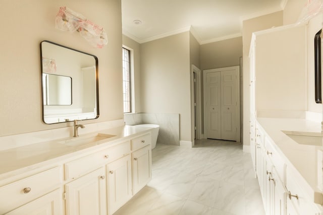 2302 Tiffany Ct, Garland, TX 75043 - bathroom featuring two vanities, marble finish flooring, a freestanding bath, and crown molding