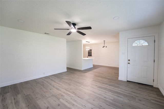 1620 E King St, Sherman, TX 75090 - entrance foyer featuring ceiling fan, a chandelier, wood finished floors, and baseboards