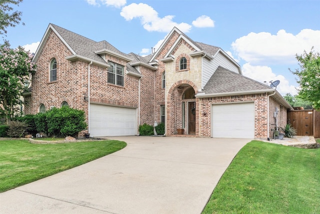 15534 Fox Meadow Ln, Frisco, TX 75035 - french country inspired facade featuring roof with shingles, driveway, brick siding, and a garage