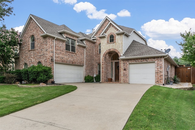 15534 Fox Meadow Ln, Frisco, TX 75035 - french country home featuring a shingled roof, driveway, brick siding, and an attached garage