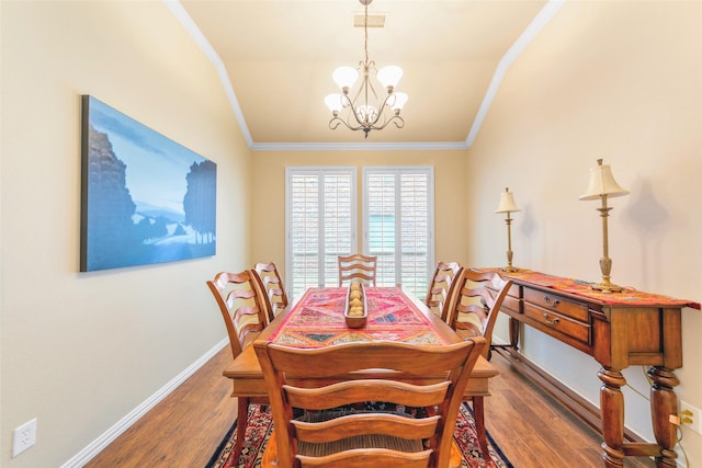 15534 Fox Meadow Ln, Frisco, TX 75035 - dining area featuring a chandelier, crown molding, wood finished floors, baseboards, and vaulted ceiling