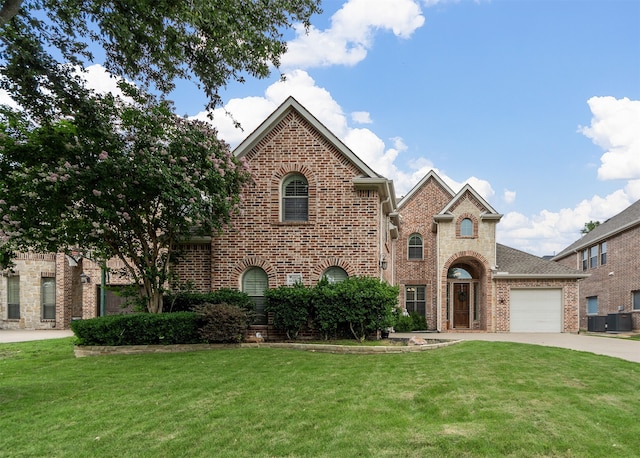 15534 Fox Meadow Ln, Frisco, TX 75035 - view of front facade featuring brick siding, a front lawn, concrete driveway, and an attached garage