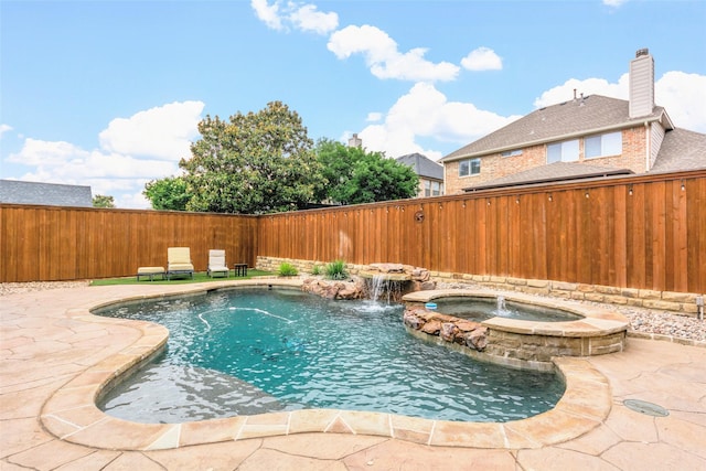 15534 Fox Meadow Ln, Frisco, TX 75035 - view of swimming pool with a fenced backyard, a pool with connected hot tub, and a patio