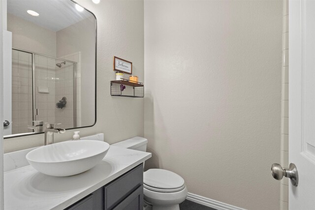 7008 Clipper Dr, Grand Prairie, TX 75054 - full bathroom with toilet, vanity, and tiled shower