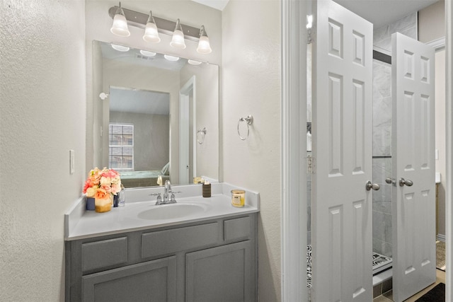 7008 Clipper Dr, Grand Prairie, TX 75054 - bathroom featuring vanity and a textured wall