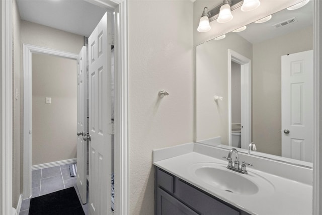 7008 Clipper Dr, Grand Prairie, TX 75054 - bathroom featuring vanity and tile patterned flooring