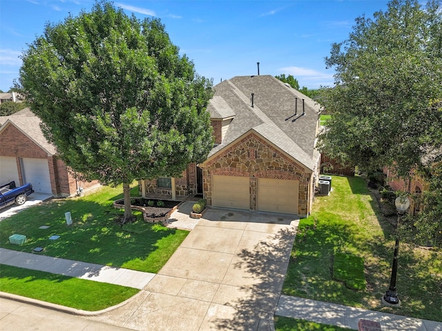 7008 Clipper Dr, Grand Prairie, TX 75054 - view of front facade featuring stone siding, a garage, concrete driveway, a front yard, and a shingled roof